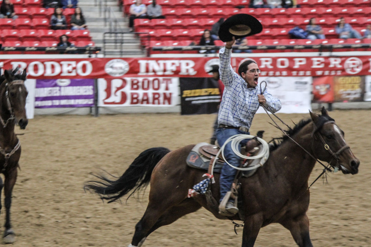 Horse rider saluting the crowd at the Indian National Finals Rodeo in Las Vegas.