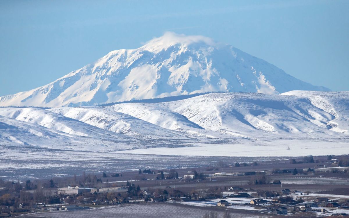 A cloud hovers over Mount Adams in Yakima, Washington.